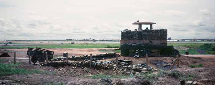 13. Biên Hòa AB, West Tower. Note the F-100 (extreme left-center), apparently being worked on. Bunker is on the West end of the runway and manned by USAF personnel. I think one of the armored cars hung out in this vicinity during alerts. Photo by: Bob Vitray, LM 590, BH, 3rd SPS, 1967-1969.