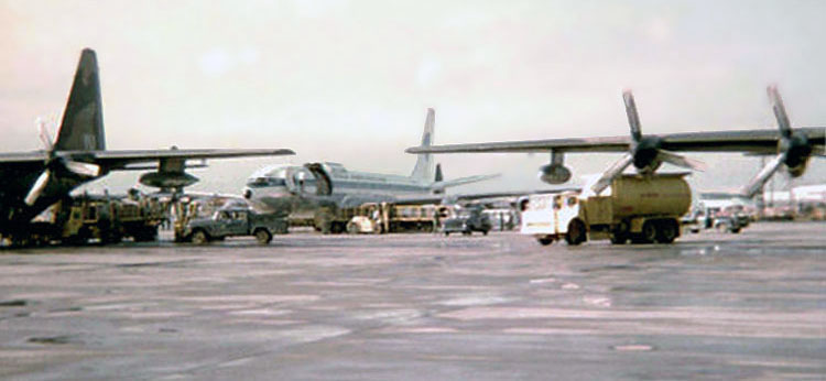 Bien Hoa AB, flight line. C-130s and Freedom Bird. 1969-1970.