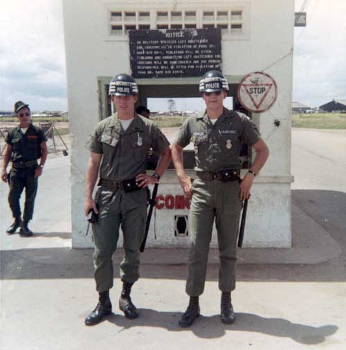 Above Photo: Gate. Dave Hechler, M16, and Brian Hawkins. Note Tower seen through gate window. 1969-1970.Below Photo: Gate Sign. Photo by: Dave Hechler, LM 571. 69-70; 71-72.