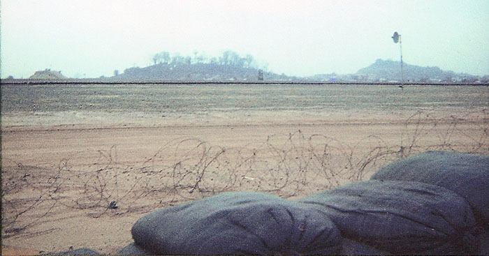 24. Biên Hòa Air Base: Michael Pollock, Perimeter post at RR Tracks. Not much of a fence line. Don't remember which perimeter. 1968-1969. Photo by: Michael Pollock, BH, 3rd SPS. 1968-1969.