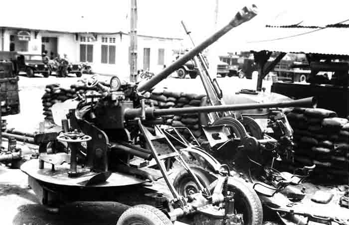 13. Biên Hòa AB. Captured AAA from the Biên Hòa area. Stored rear of CSC. 1965. Photo by: Phil Block, LM 203, BH, 3rd SPS; TSN, 377th SPS, 1965-1968.