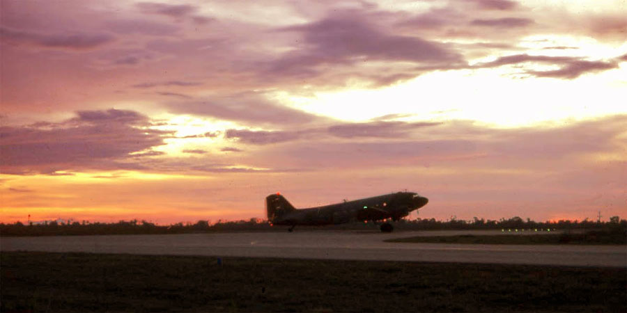Bien Thuy Air Base, flight line and runway at sunset. C-47 taxies for takeoff. MSgt Summerfield: 01