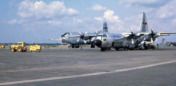 Bien Thuy Air Base flight line. C-130 unloads. Globemaster in background. MSgt Summerfield: 13