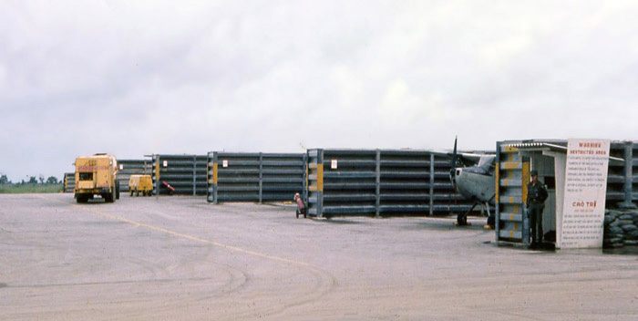 Bien Thuy Air Base flight line. USAF SP guards entrance to O1E-Birddog revetments. MSgt Summerfield: 14