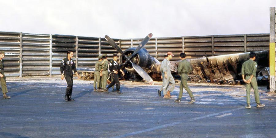 Bien Thuy Air Base, flight line damage inspected by VHAF pilots and crews. A1E revetments heavily damaged. MSgt Summerfield: 27