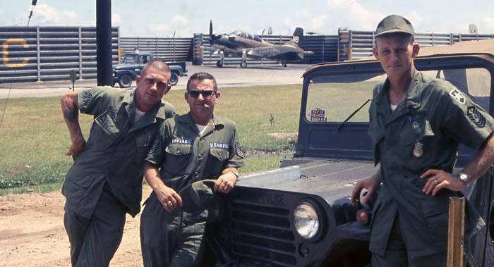Bien Thuy Air Base revetments. CMSgts Summerfield work hard, while Senior MSgt leans on jeep. MSgt Summerfield: 34