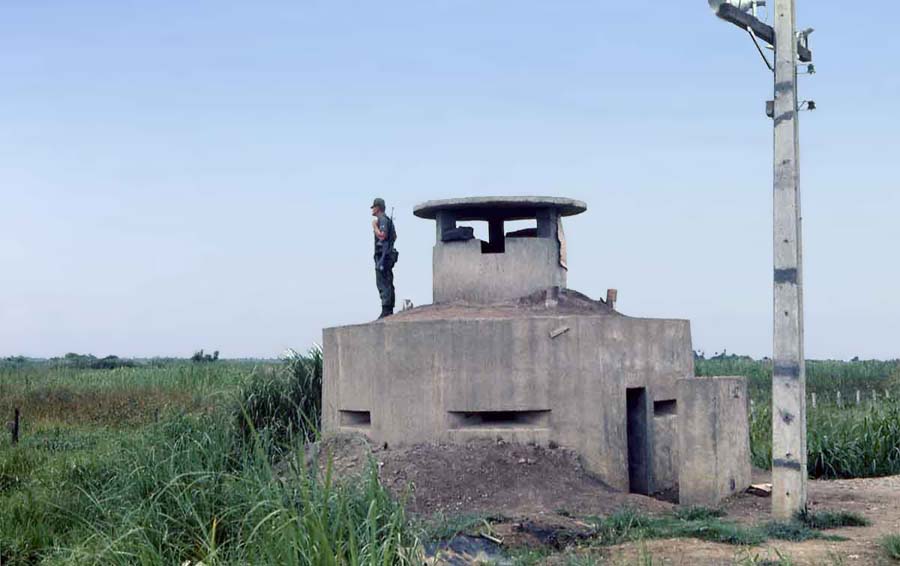 Bien Thuy Air Base, Good Morning World. SPS Airman stands watch from perimeter-bunker with 50cal inside. MSgt Summerfield: 05