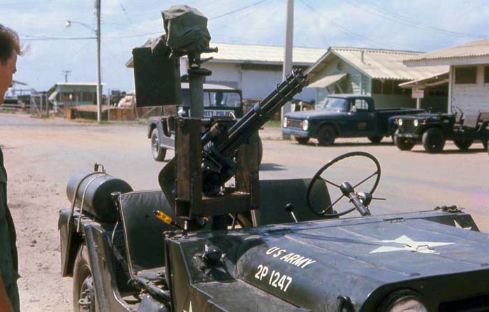 Bien Thuy Air Base, USAF SPS jeep, and US Army jeep with mini-gun. MSgt Summerfield, 1968: 19