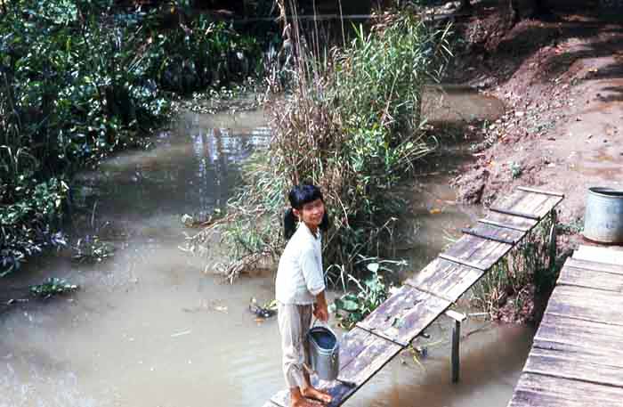 Bien Thuy Air Base. Village girl fetching river water. MSgt Summerfield: 08