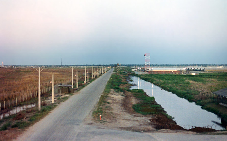 66) Bình Thủy Air Base Perimeter: This is the original photo the above composite graphics are based on, and taken  during  daylight. Note that lights are beginning to come on in expectation of the coming night.