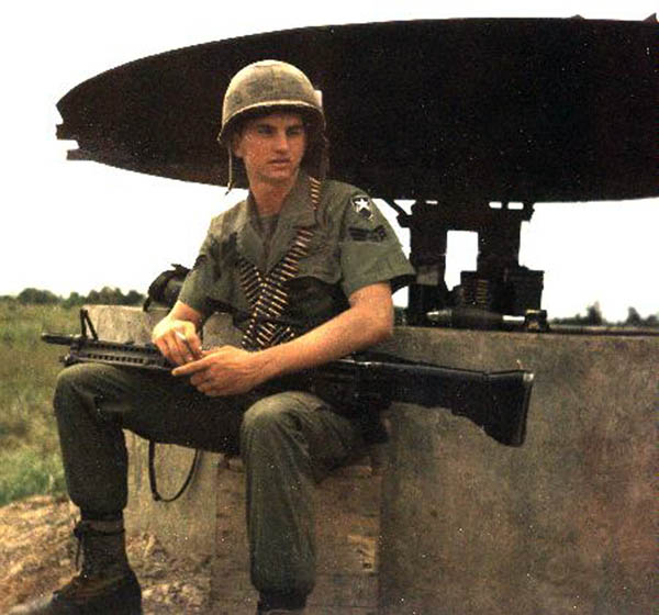12) Mike Mckeal, Bunker duty with M60 and ammo belts.