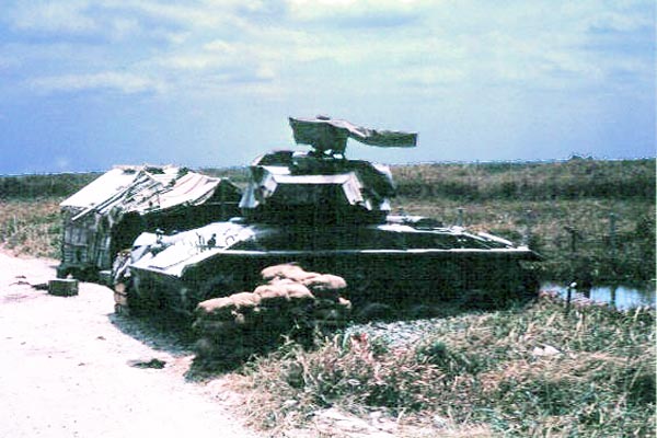 032: Bình Thủy AB, perimeter with tank. Photo by: Dr. Mel Hecker, 1968