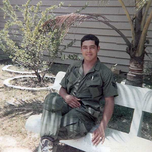 24. BT Air Base: Jaime sitting outside of the club. Photo by Jaime Lleras. 1970.