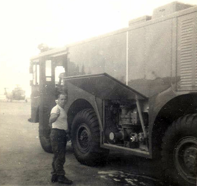 3. Fireman doing his check list on a P-2 Crash-Fire truck.