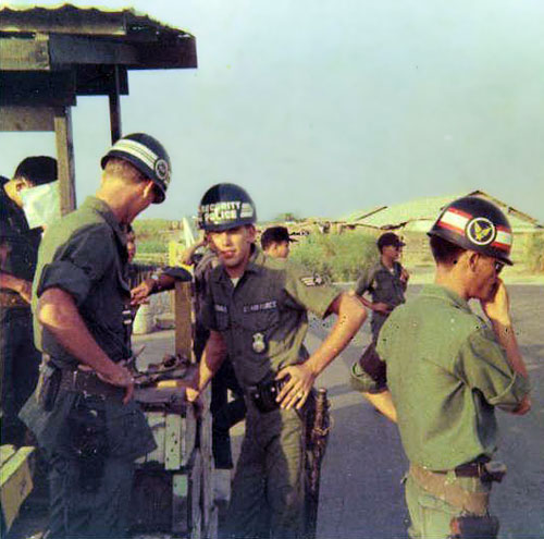 13. A1/C Byrd, SGT. McFarland & QC guard at the main gate to Binh-Thuy AB 1968.