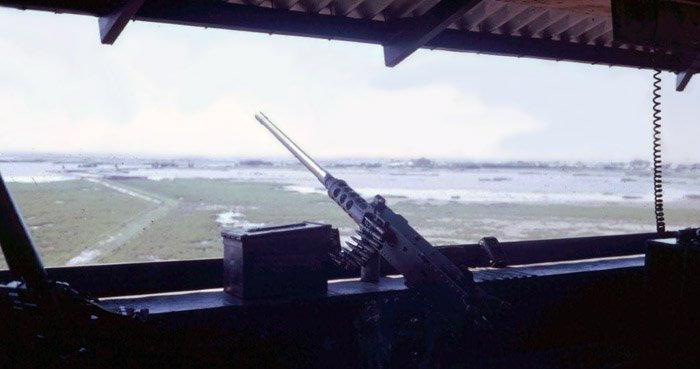 6. Cam Ranh Bay AB. Perimeter Tower view. M-16 (lower-left) and .50-Cal on the counter. 1970. Photo by: Jim Randall, LM 69, CRB, 483rd SPS, 1970.