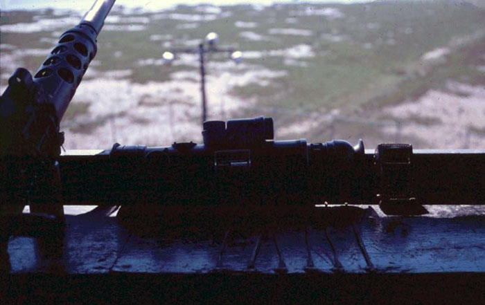 2. Cam Ranh Bay AB. Perimeter Tower view. .50-Cal and Starlite scope on the counter. 1970. Photo by: Jim Randall, LM 69, CRB, 483rd SPS, 1970.