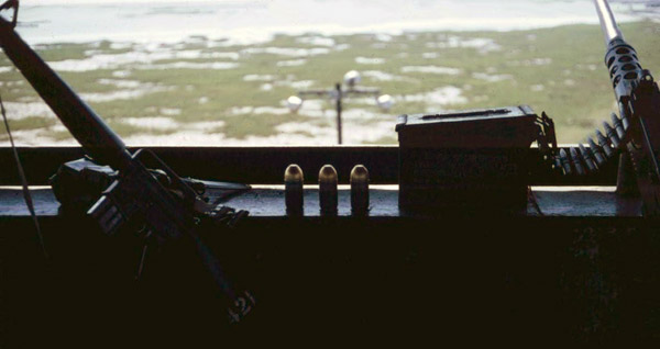 3. Cam Ranh Bay AB. Perimeter Tower view. M-16, 40mm, and .50-Cal on the counter. 1970. Photo by: Jim Randall, LM 69, CRB, 483rd SPS, 1970.