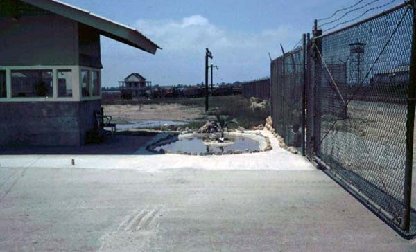 1a. Cam Ranh Bay AB, Gate. Note the Tower through the sliding-gate. See anything unusual? Photo by: unknown.