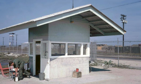 2. Cam Ranh Bay AB. US Navy Gate-64. Note Tower-63 visible beneath gate's eves (above Airman). Photo by: unknown.