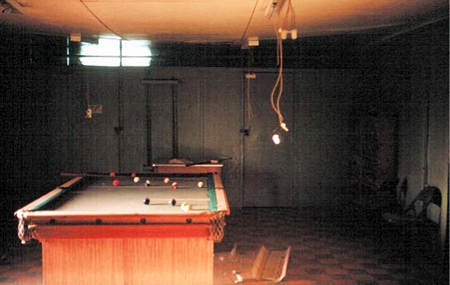 18. Đông Hà Air Field: Day room with pool table. Damaged interior.