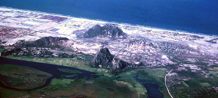 Đà Nẵng AB: Marble Mountain to the East. End of war we discovered the entire mountain was an VC/NVA tunnel stronghold.