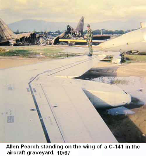 Đà Nẵng Air Base, SVN: USAF Allen Pearch standing on the wing of a C-141 Starlifter in the aircraft graveyard. Oct. 1967.
