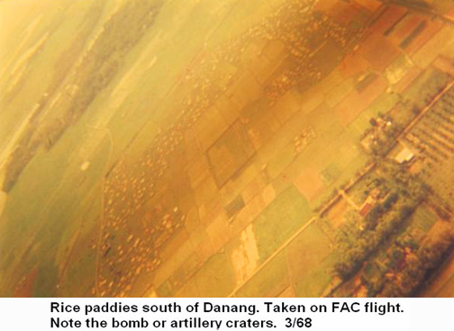 Đà Nẵng Air Base, SVN: USAF, rice paddies pock marked with bomb craters south of Đà Nẵng. Photo taken from FAC O2E flight. Note artillery and bomb craters. Mar. 1968. © 2011 by Bradford K. Deal