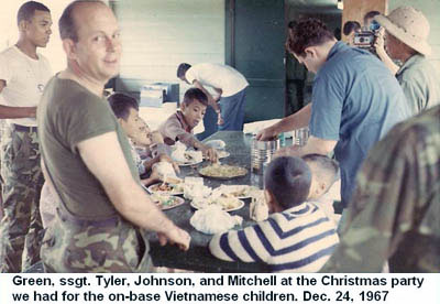 Đà Nẵng Air Base, SVN: USAF Green, SSgt Tyler Johnson, and Mitchell at Christmas Party for Vietnamese kids. Dec. 24, 1967.