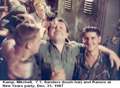 Đà Nẵng Air Base, SVN: USAF Kamp, Mitchell, Sanders, and Ramos at New Years party, Dec. 31, 1967.