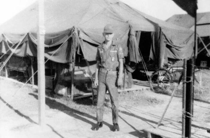 2. Đà Nẵng AB, Tent City: A2C James Bruce Jones (JB) read to go to post. 1966.