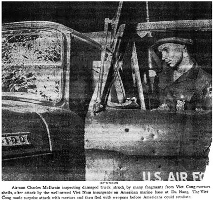5. Đà Nẵng AB, Tent City: Airman Charles McIlwain inspects damaged AF POL Pickup truck. Fragments riddled the driver's side. 1966.