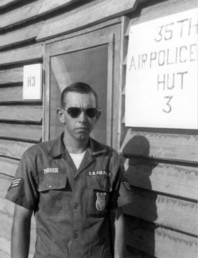 12. A1C Darrell Parker, front of new 35th APS Hut #3.