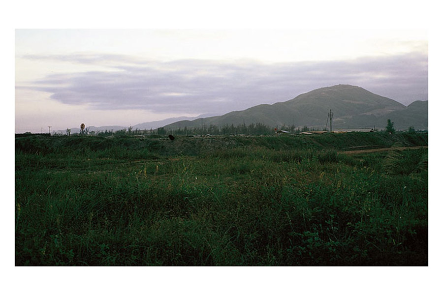 39. Đà Nẵng AB, K-9 Growl Pad: S/B West-Perimeter Road, approaching Ammo-Bomb Dump entrance road. 1965. Click Photo for Full View.