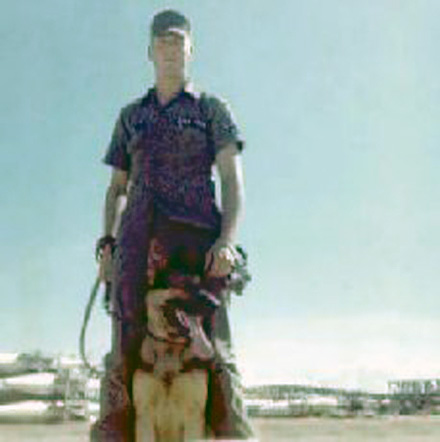 3. Đà Nẵng Air Base: Sign: 366th SPS Handler Robert Lee and MWD Shep. Photo by Greg Dunlap. 1968-1969.