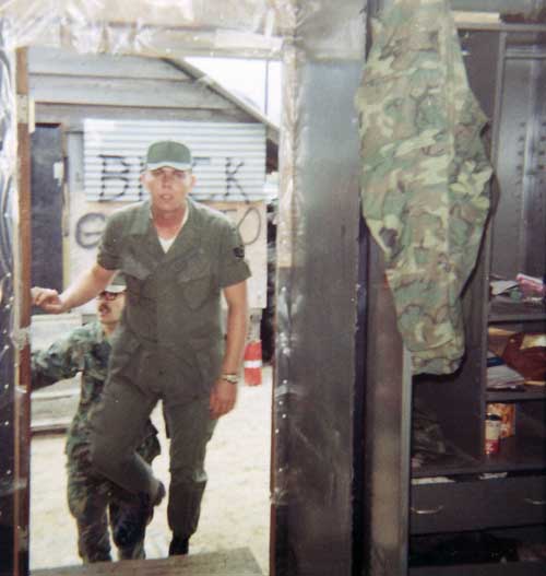 Photo #13 (Nha Trang): This is a shot of me in my cube in the new barracks. I often thought about sending this photo to Hills Bros Coffee for an ad but never did.