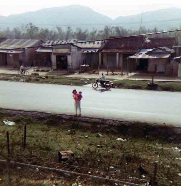 Photo #13 (Nha Trang): This is a shot of me in my cube in the new barracks. I often thought about sending this photo to Hills Bros Coffee for an ad but never did.