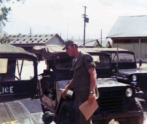 Photo #13 (Nha Trang): This is a shot of me in my cube in the new barracks. I often thought about sending this photo to Hills Bros Coffee for an ad but never did.