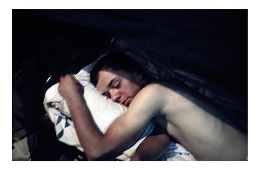 30. Đà Nẵng AB, Tent City: James Bruce Jones, sleeping hard after a long shift around Christmas 1965. 1966.