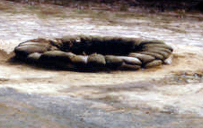 Da Nang Air Base: Air Police used this common shaped sandbag fighting-hole for perimeter and base defense.