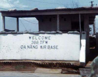 13. Da Nang AB, Front Gate 1968. Shrapnel holes all around the sign, Welcome 366 TFW Da Nang Air Base. Photo by: Greg Dunlap, DN, 366th SPS K9, 1968-1969.