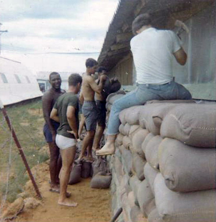 8. Đà Nẵng AB, 366th SPS. Adding layers to sandbag wall around huts. Photo by: Ralph Manganiello Jr. 1966-1967.