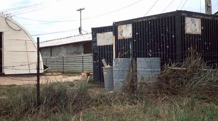 9. Đà Nẵng AB, 366th SPS. Rocket shrapnel peppers SP huts, quonset hut and storage containers, indifferent as always. Photo by: James Paul Mashburn 1966-1967.