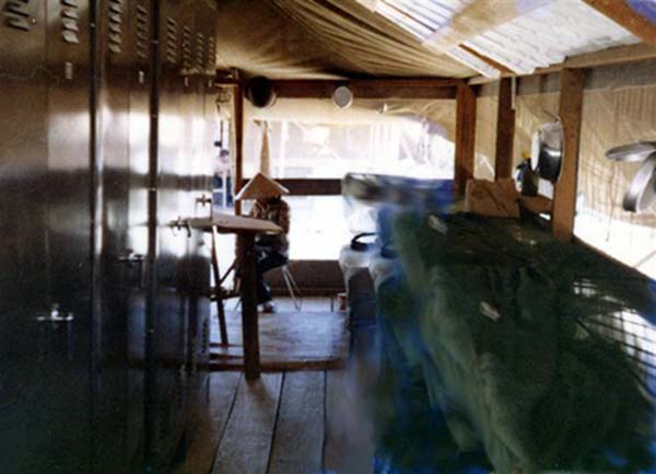 14. Đà Nẵng AB, 366th SPS. Tent City Mamasan working on boots (center). Photo by: James Paul Mashburn 1966-1967.