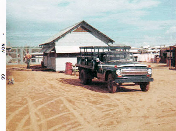 5. Đà Nẵng AB, 366th SPS, K-9: Growl Pad Squadron Room building. K-9 Posting Truck parked nearby. Photo by: Lee Miller, Nov 1966.