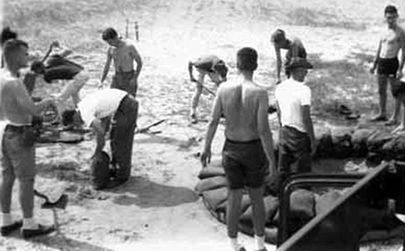 9. Đà Nẵng AB, 366th SPS, K-9: K-9 handlers fortifying K-9 Fighting Hole.
Gary Knutson, second from right. Don Poss is third from left. Photo by: Lee Miller, 1965-1966.