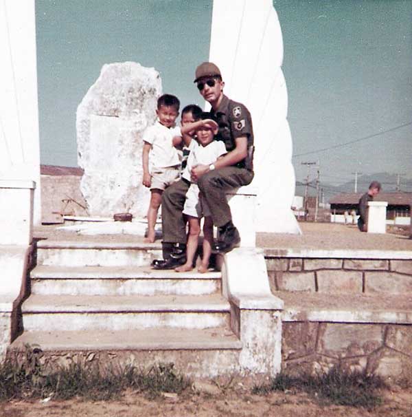 6. Đà Nẵng Air Base: 366th SPS. SSgt Perez with war orphant children from St. Marks, Đà Nẵng city. Photo by Ronald A. Perez, 1967.