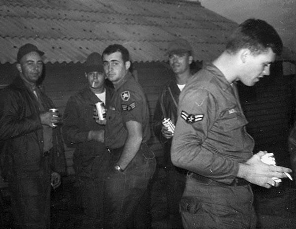 11. Đà Nẵng Air Base: 366th SPS. Airman relax after rocket attack. Photo by Ronald A. Perez, 1967.