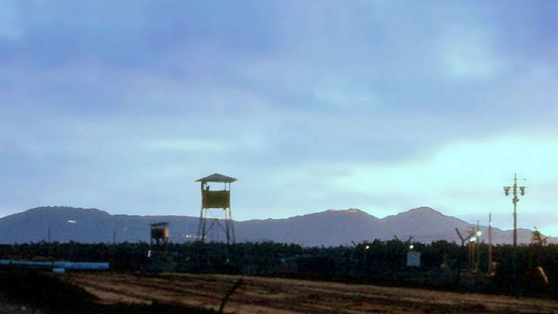 1. Đà Nẵng AB, Perimeter Tower. Monkey Mountain in distance. Photo by: Ronald A. Perez, DN, 366th SPS, 1966-1967.