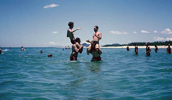 25. China Beach, Đà Nẵng: Water fight! Left, Gary Knutson riding Gary Eberbach's shoulders.